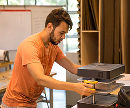 Photo of a student working on a project. Link to Tangible Personal Property.