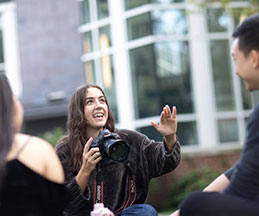 Photo of a photography student. Link to Closely Held Business Stock.