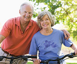 Photo of a man and woman on bicycles. Link to Life Stage Gift Planner Ages 60-70 Situations.