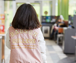Photo of a student wearing a Babson jacket. Link to Gifts of Cash, Checks, and Credit Cards.